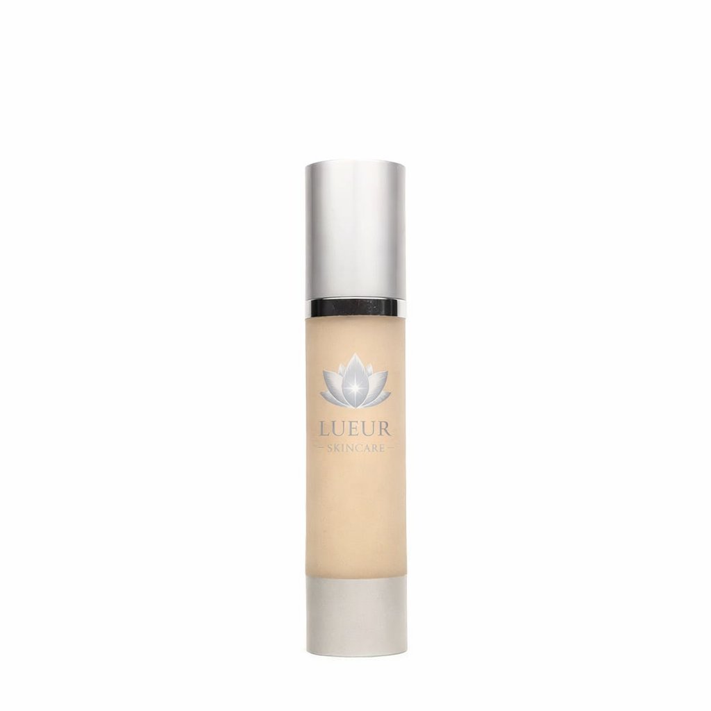 Luftur skincare serum bottle with metallic silver cap and beige liquid, featuring a lotus flower logo