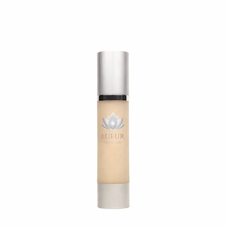 Luftur skincare serum bottle with metallic silver cap and beige liquid, featuring a lotus flower logo